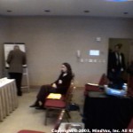 [Left to Right] Daniel Pinchbeck, Howard Lotsof's back, and Patrick Kroupa standing in the doorway. Plus, also, sum chick sitting in the center of the room